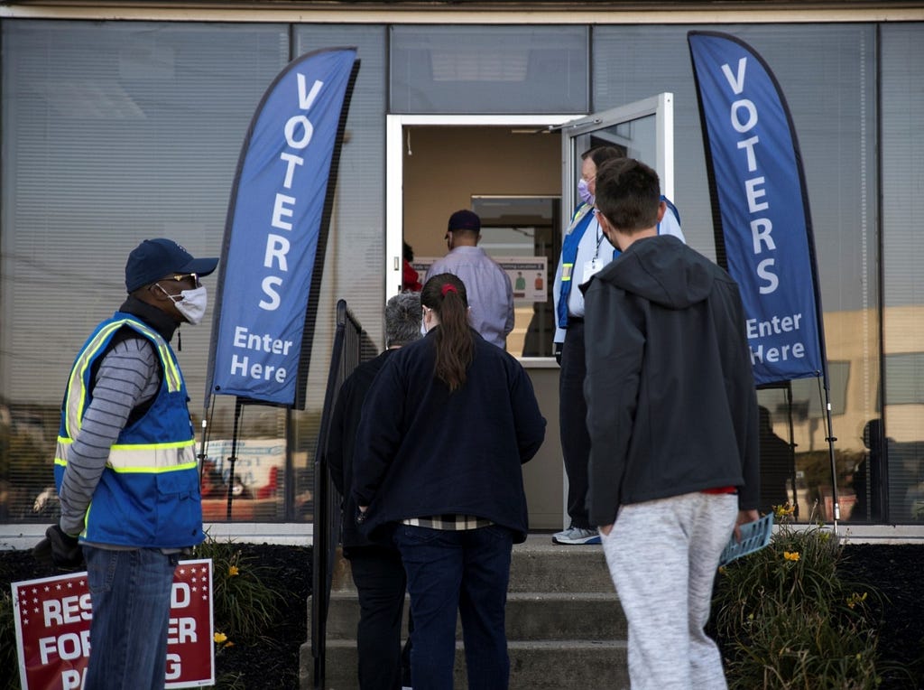 Voters line up to cast ballots as early voting begins in Cincinnati, Ohio, October 6, 2020. Photo by Megan Jelinger/Reuters