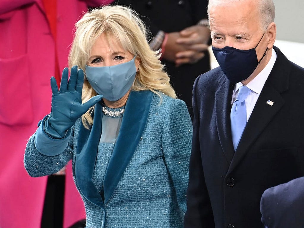 Jill Biden’s face mask matched her dress and gloves, too.