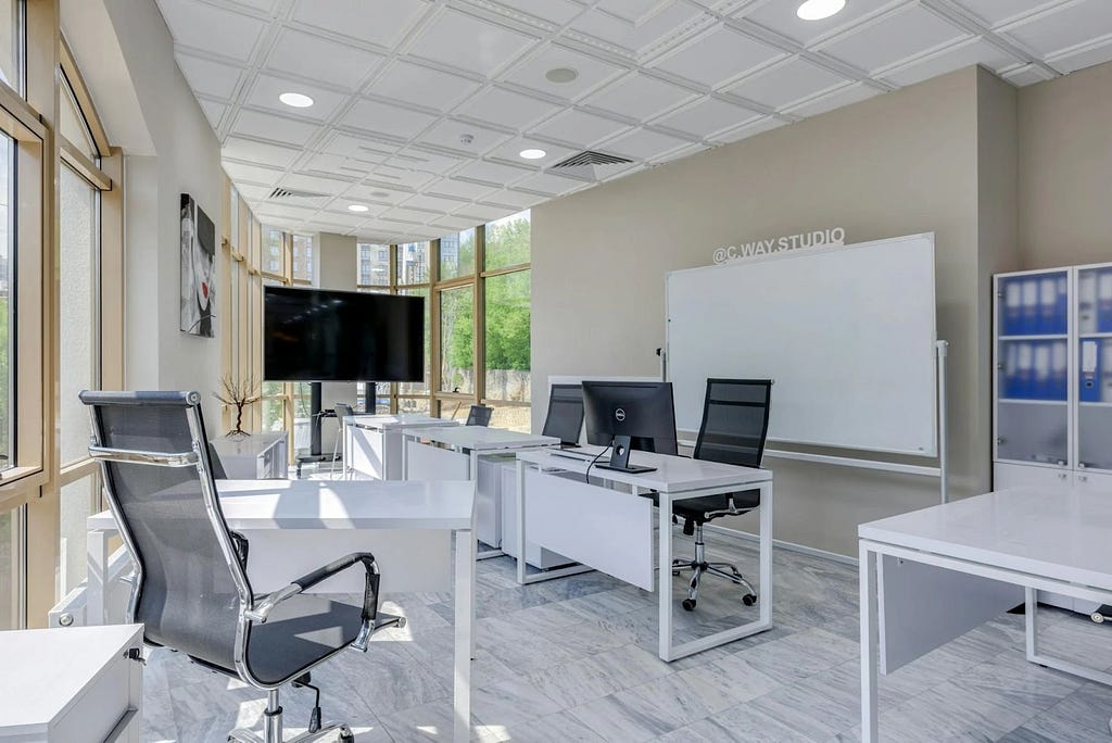 Ergonomic office setup with adjustable desks and chairs