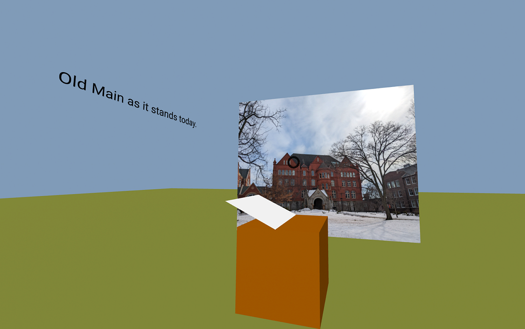 An image of present-day Old Main stands on the opposite side of a lectern with a book on top of it. To the left is a brief caption explaining the photo, which reads: “Old Main as it stands today.”