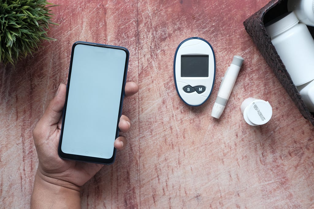 Phone and medical devices for diabetes treatment