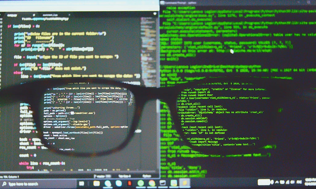 A screen with Python code seen through a pair of glasses