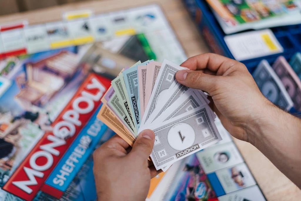 A person playing Monopoly