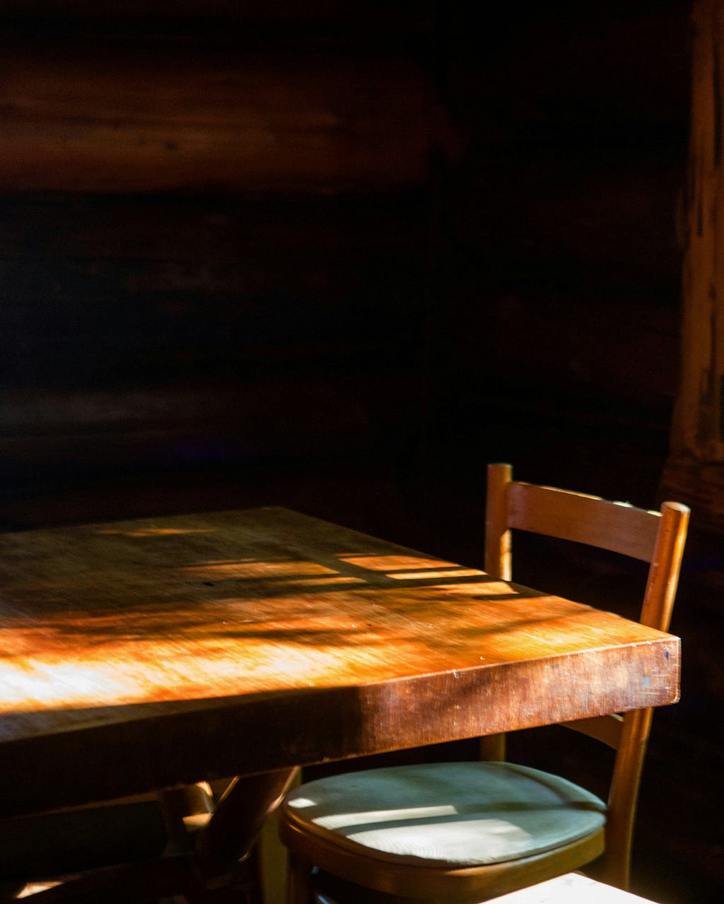 Table and chair in morning light. 