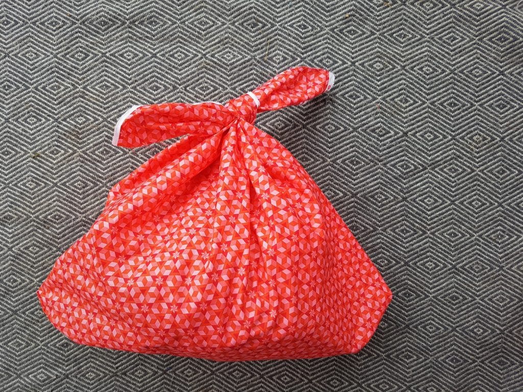 A red furoshiki bag