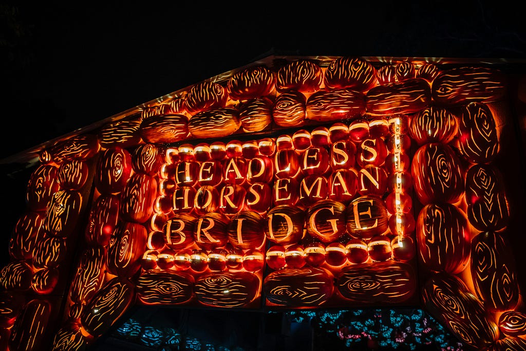 I think it’s a road-sign, but it might be an artwork or a very glazed, slightly overcooked pastry. Whatever it is, it says “Headless Horseman Bridge”.
