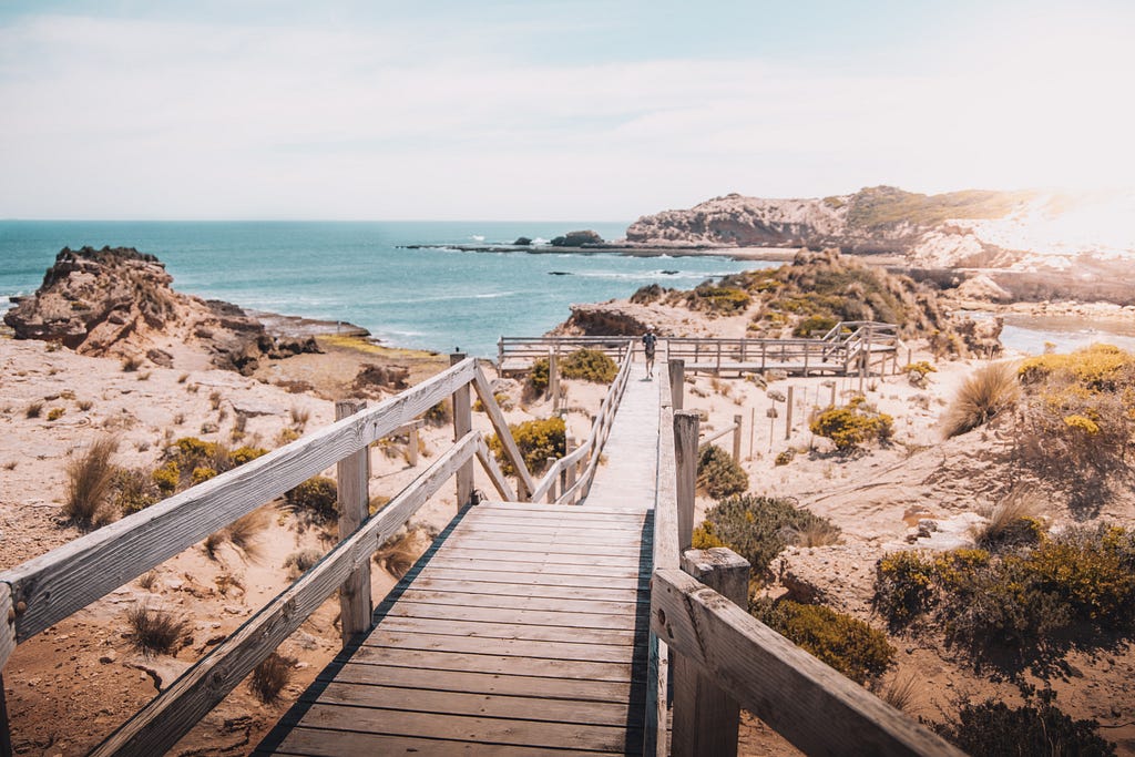 A walkway that leads down to the beach.