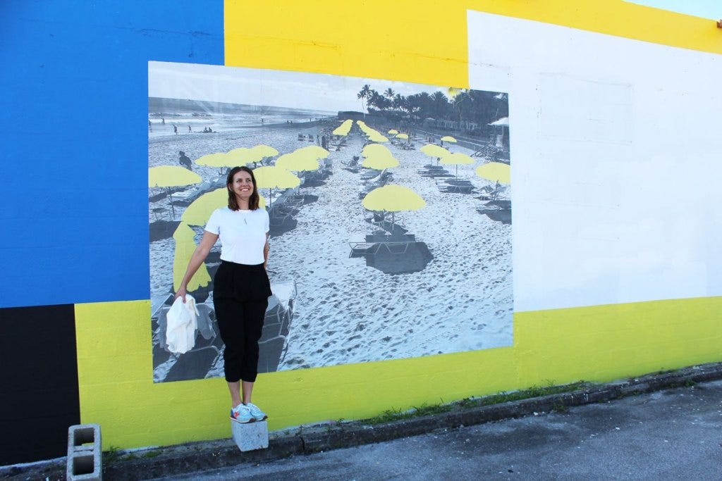 Nicole Gallardo standing in front of street art.