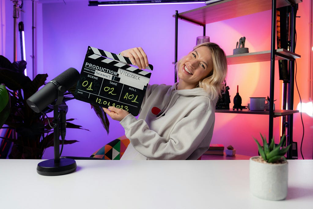 A female YouTuber in her studio about to shoot a video