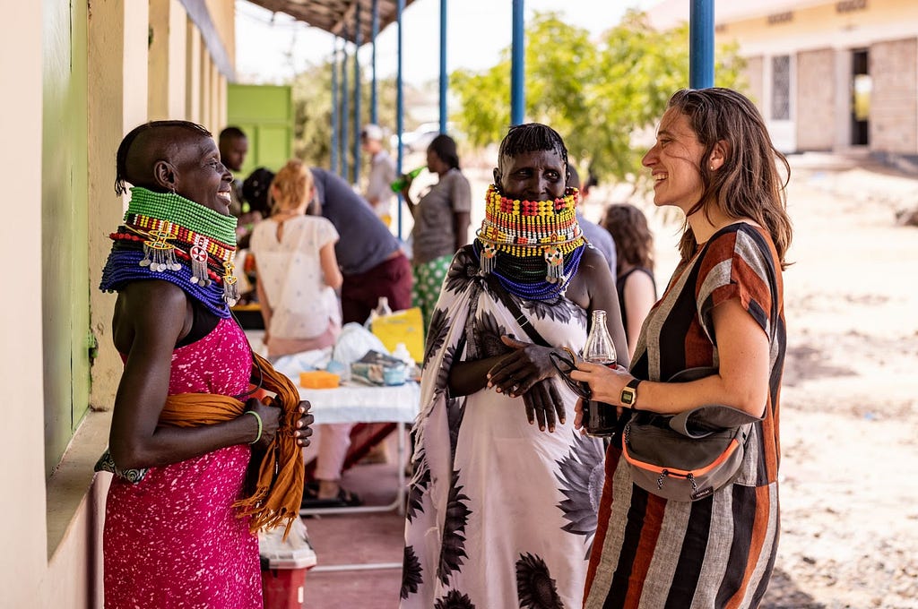 Sarah LeBaron von Baeyer, Director of Ethics and Engagement at Variant Bio (furthest right), at a project information session set up for community stakeholders during the 2023 Turkana Cultural Festival held in Lodwar, Kenya.