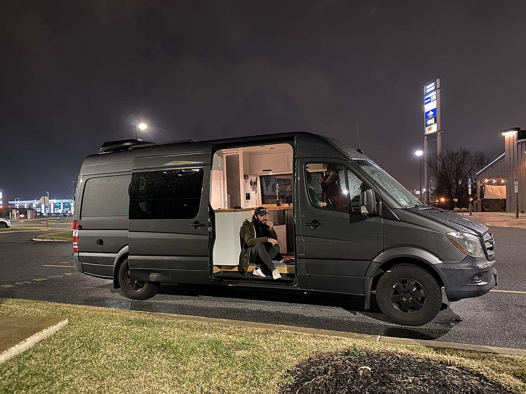 Frank Olito sitting in the van he rented.