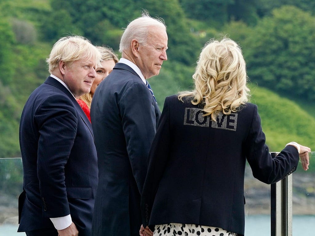 President Joe Biden and first lady Jill Biden walk with British Prime Minister Boris Johnson and his wife Carrie Johnson.
