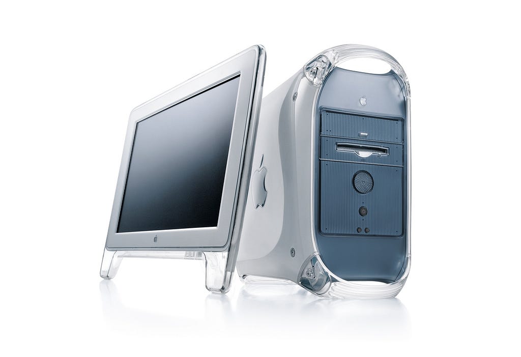 A PowerMac G4 Apple Computer with a monitor.