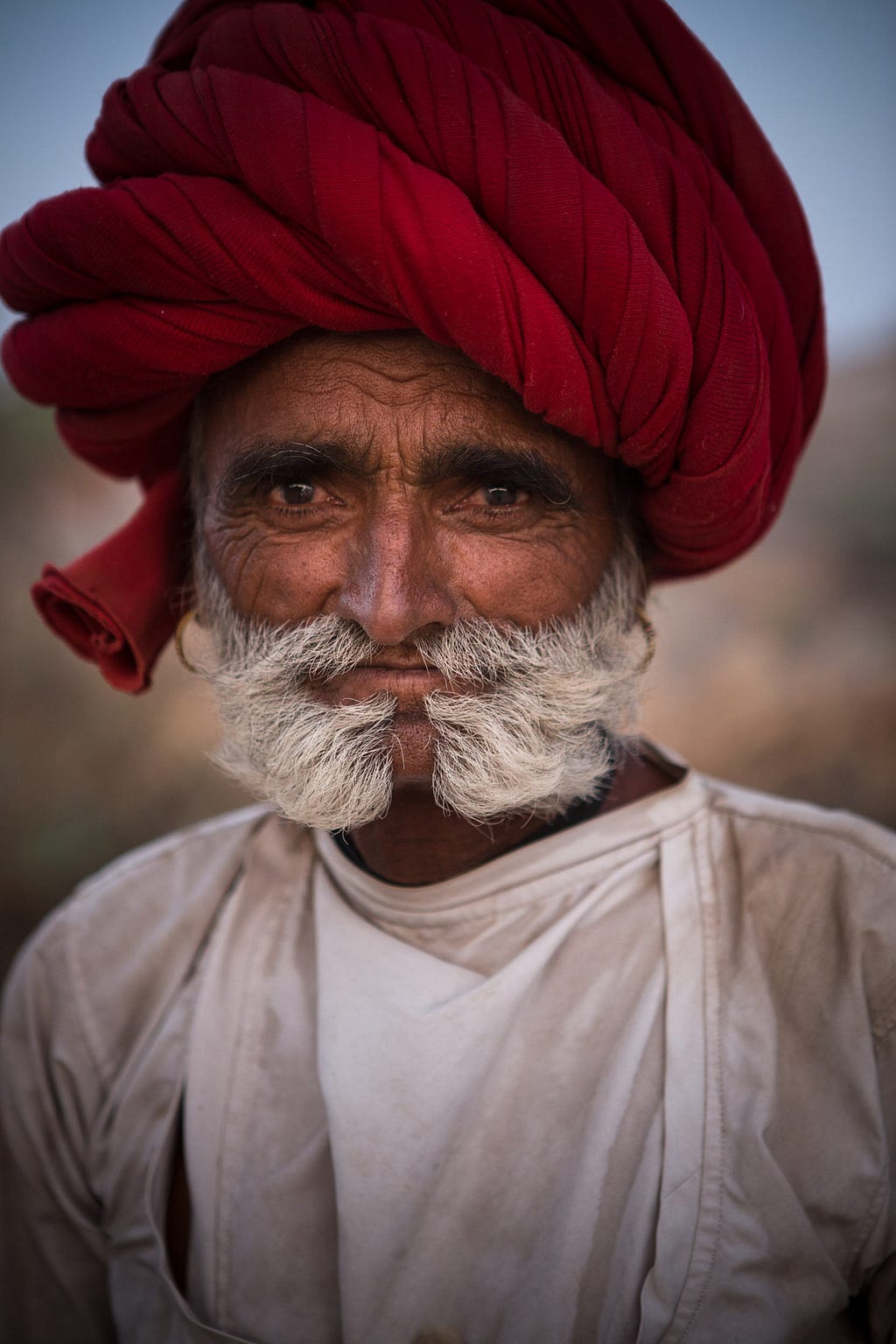 Rabari men like herder Dheera Ram favor extravagant turbans and embroidered juti slippers.