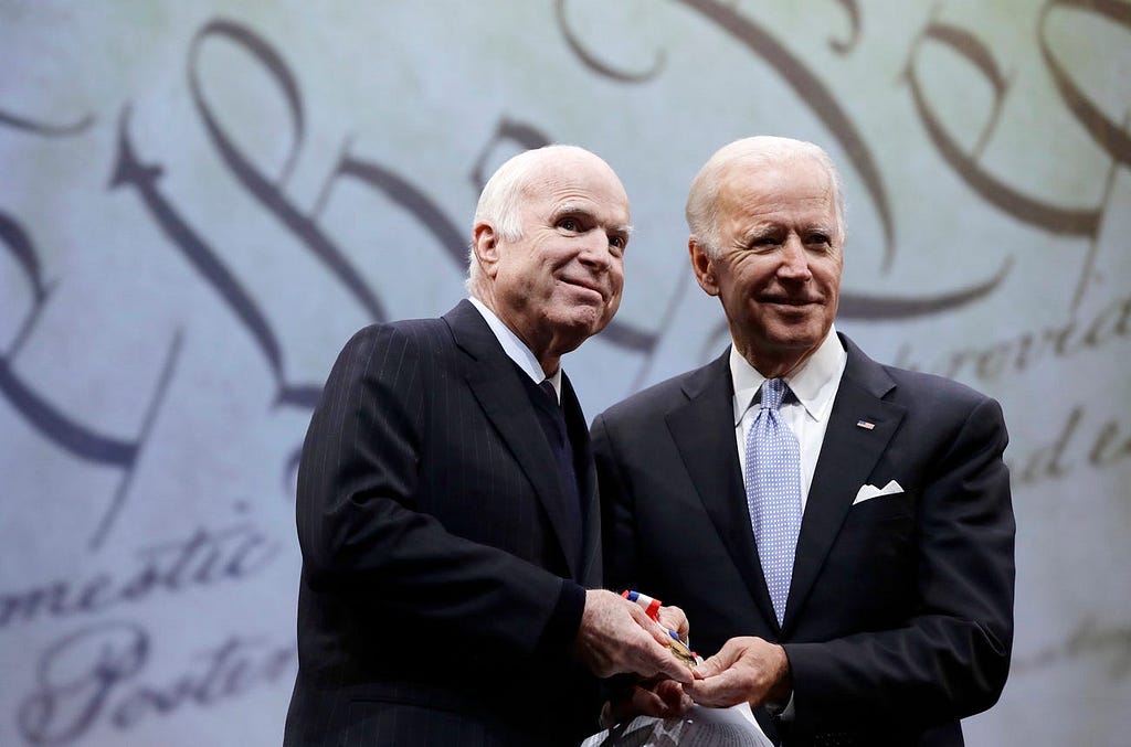 Sen. John McCain receives the Liberty Medal from former Vice President Joe Biden.