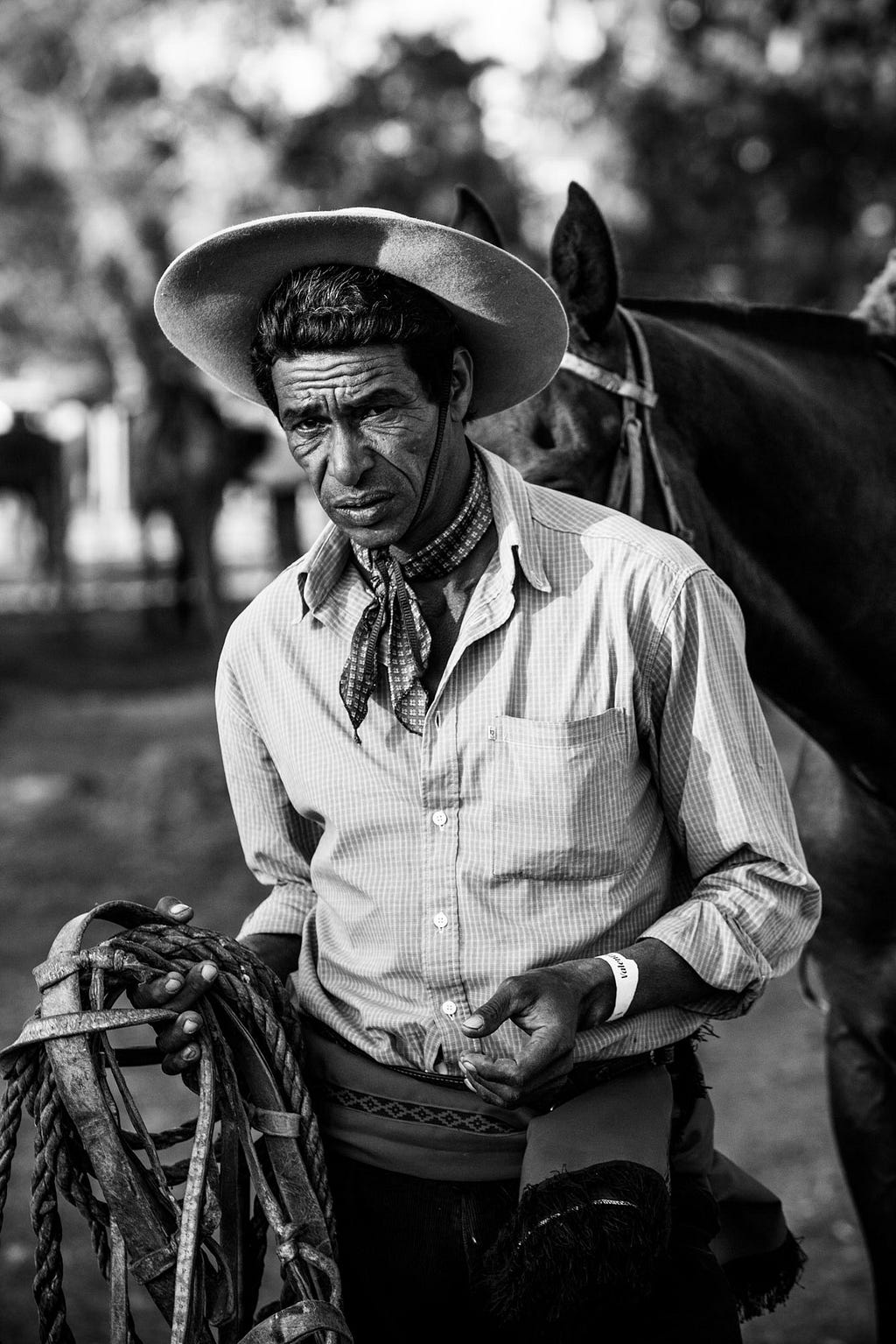This gaucho made a new set of reins and lariat from cowhide for one of the regional criollas, or rodeo gatherings that draw competitors from every part of Uruguay on weekends. ©James Fisher 2017 All Rights Reserved