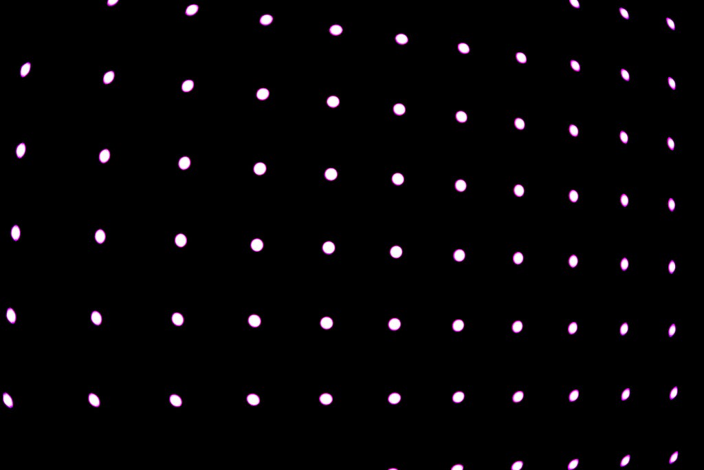 White dots on a black background