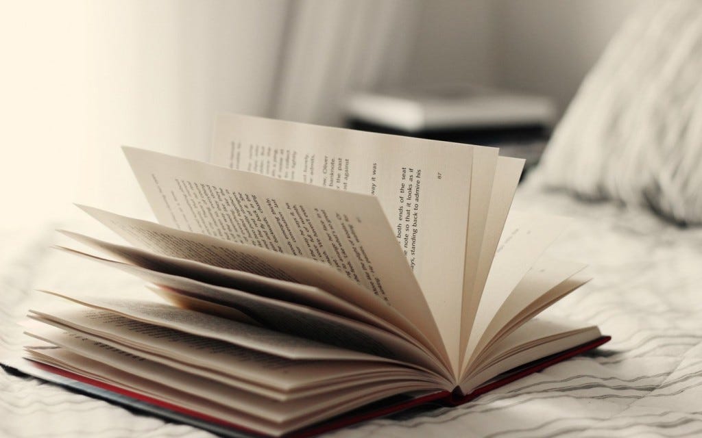 open-book-pages-on-bed-hd-wallpaper