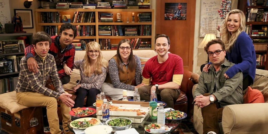 The seven core cast members of the show The Big Bang Theory posing for a photo.