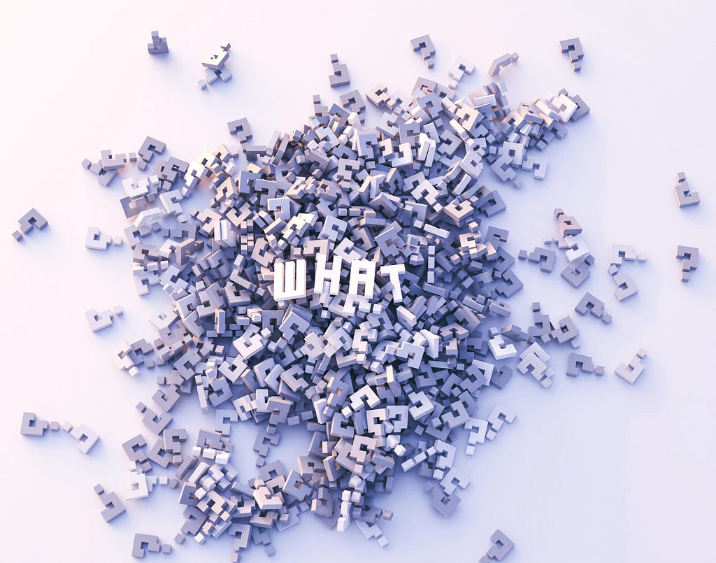 Masses of light grey 3D question marks in an unordered pile on a white background, on top of the pile the letters W, H, A and T in white to illustrate the word “What”