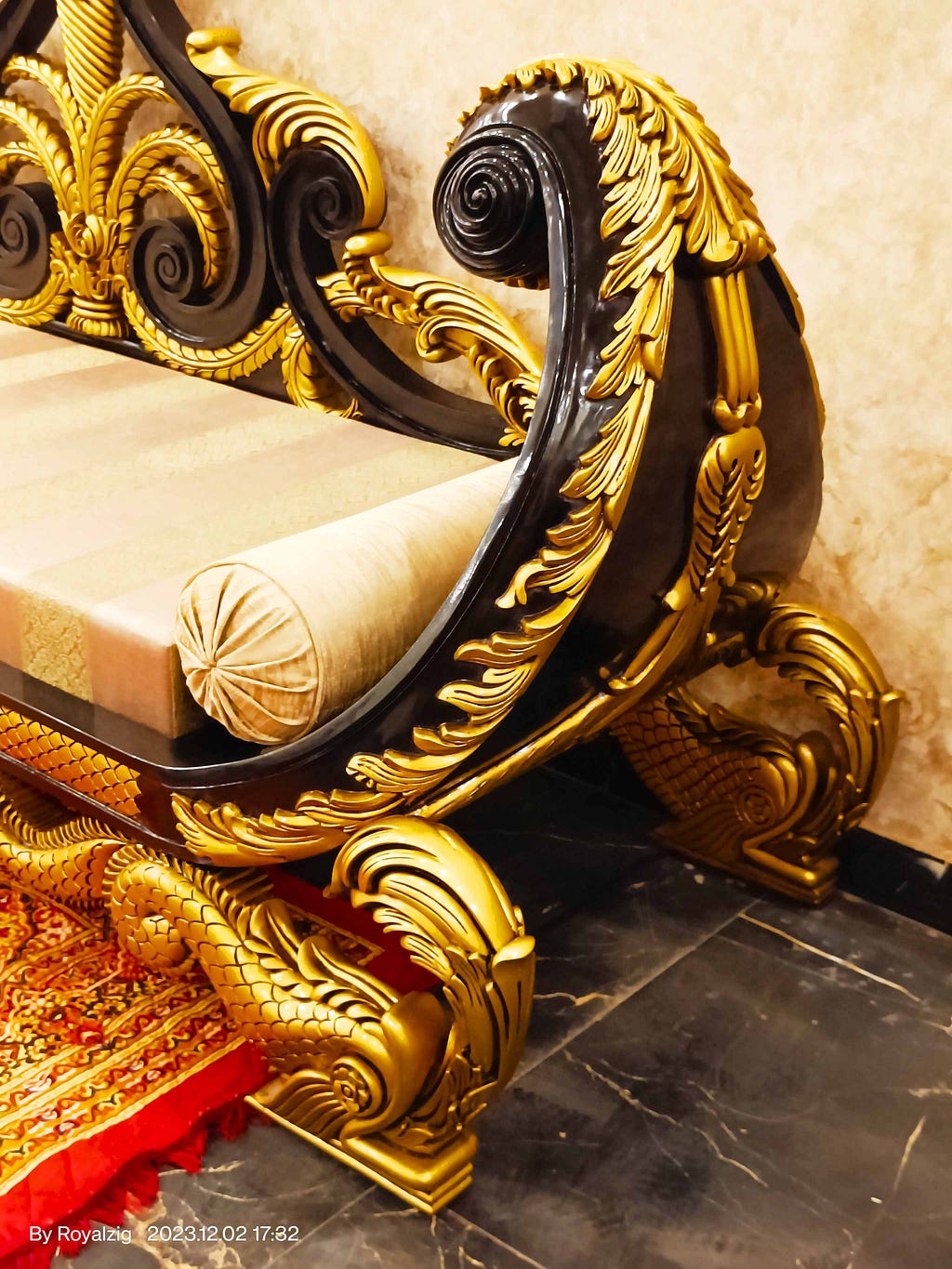 Crafted to Rule with Elegance and Artistry Through Its Royal Design, Premium-Quality Materials, and Mesmerizing Wood Carving, This ‘Maharaja Sofa’ in Teak Wood Carving with Luxurious Jacquard Fabric — Royal Golden Color — Boasts a Majestic Design Handmade in India by Royalzig Luxury Furniture .