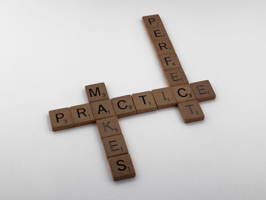 Scrabble pieces that link to read the practice makes perfect