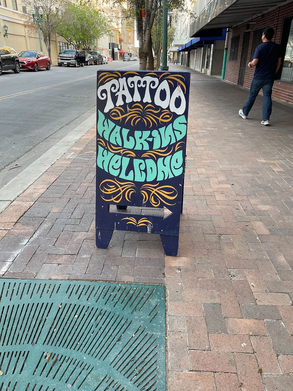 A sign that reads “Tattoo Walk-Ins Welcome”