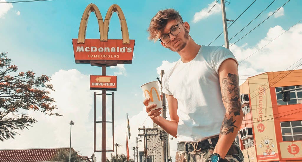 Upset customer standing outside McDonald's