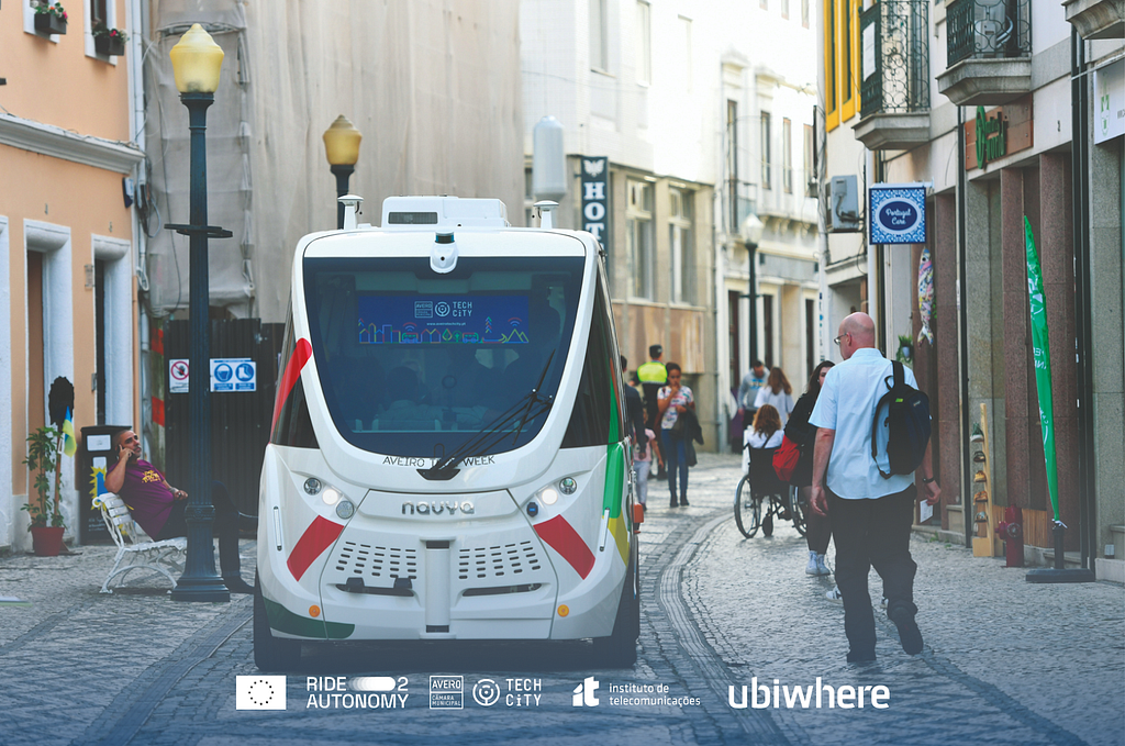 Photograph of an autonomous shuttle driving on a street reserved for pedestrians in Aveiro, as part of the Ride2Autonomy project (taken in October 2022)