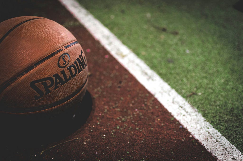 A basketball sitting on a school track