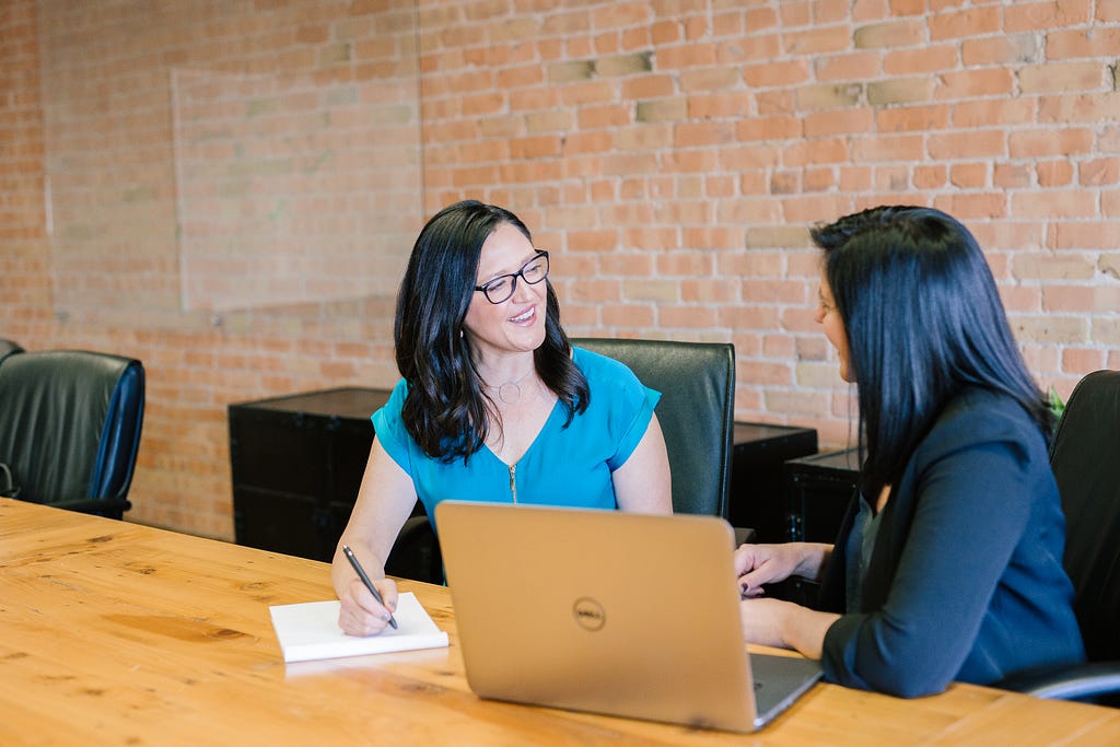 one woman interviews another woman