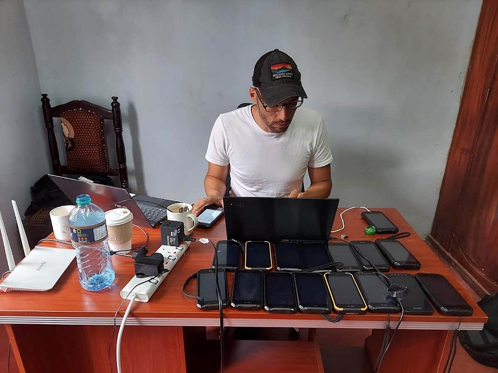 Debugging phones at the CIPDP office in the nearby city of Kitale.