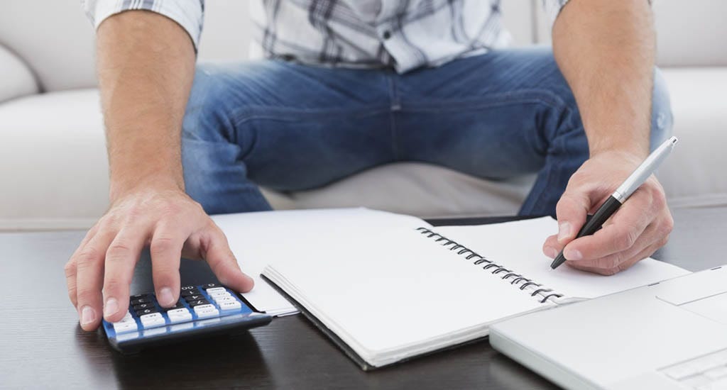 Entrepreneur calculating his finances