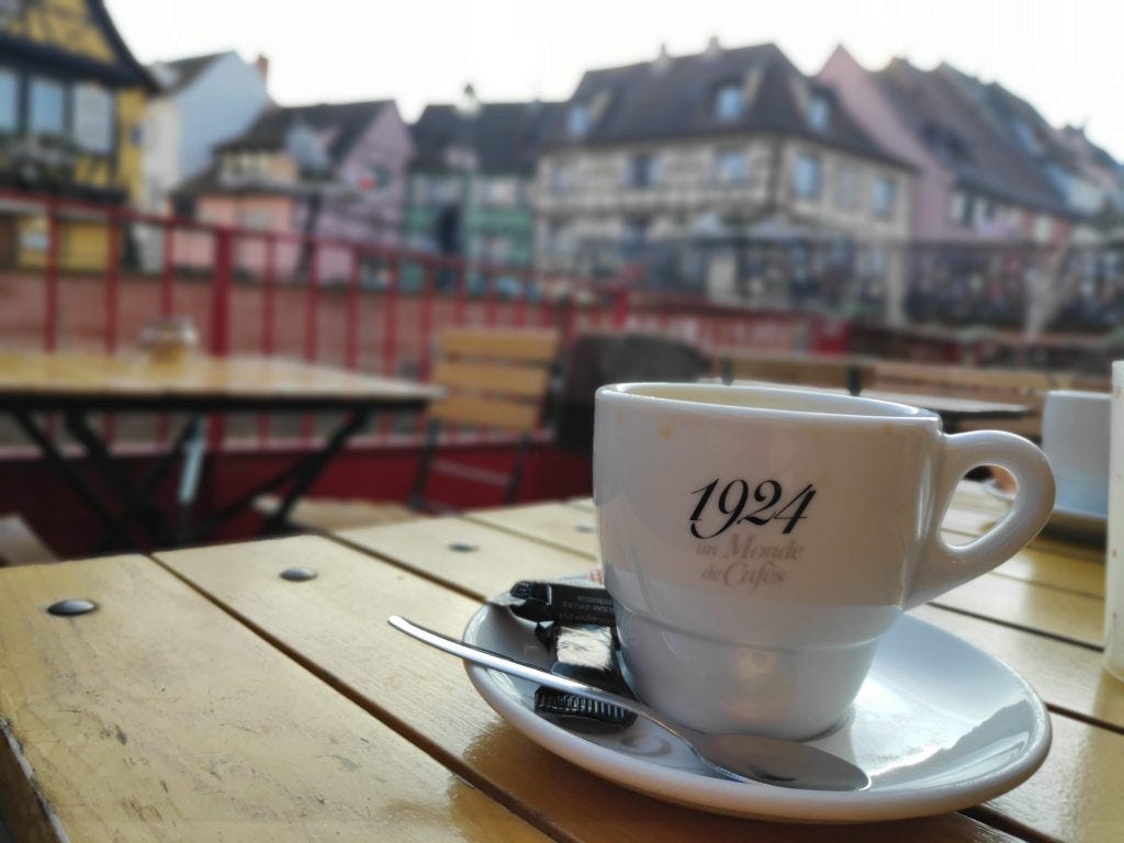 having coffee in the Little Venice area of Colmar