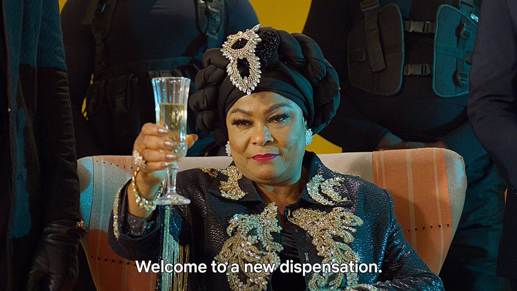 A picture of Sola Sobowale, a Nollywood actress, hold a glass of wine with a stern face and there is a caption “Welcome to a new dispensation” on it.