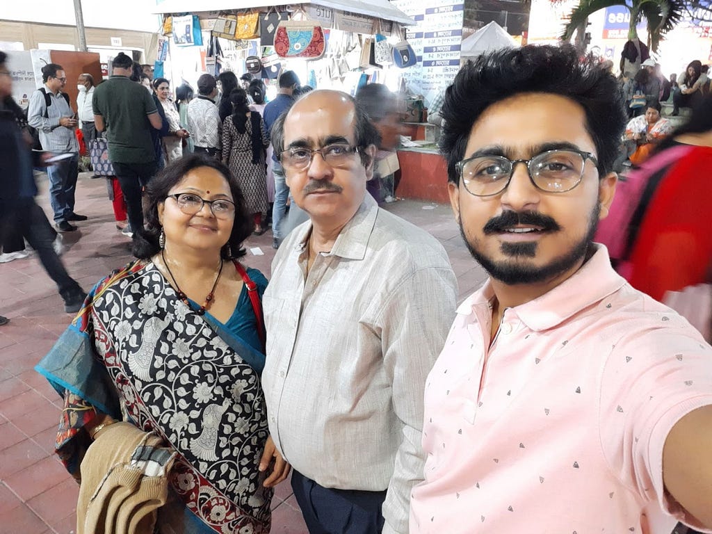Dwaipayan C with mother and father taking a selfie inside the Kolkata Bookfair 2023