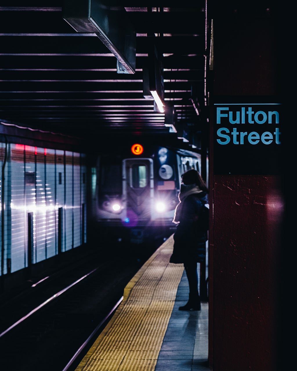 subway train approaching Fulton street station