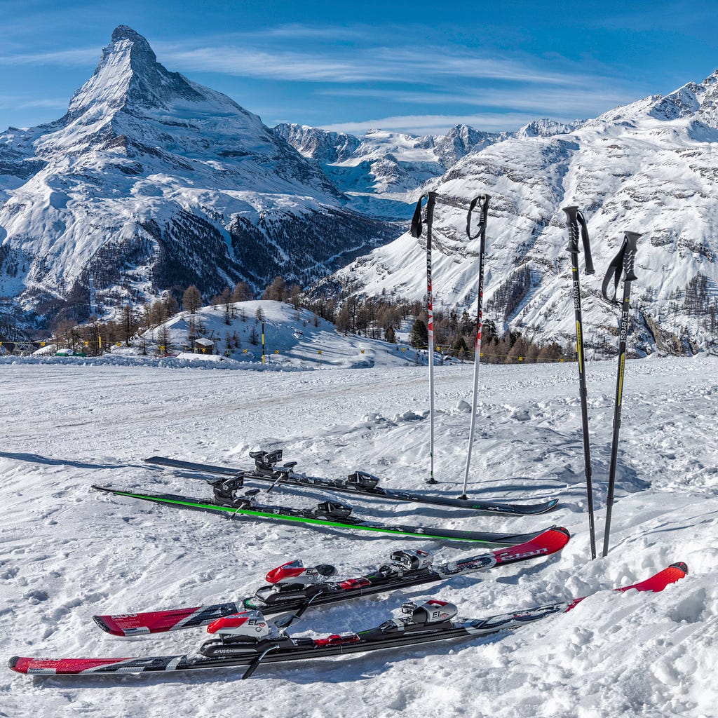 Skis and poles atop the mountain.