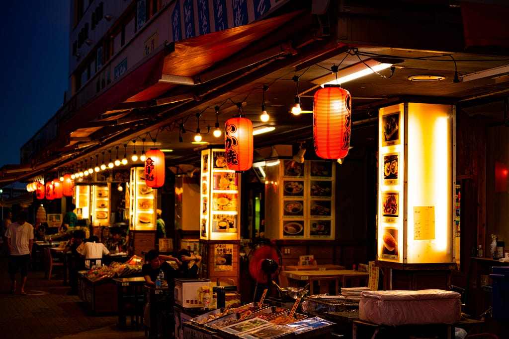 A japanese street lined with small restaurants