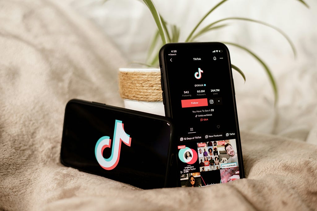 Two phones displaying the TikTok app