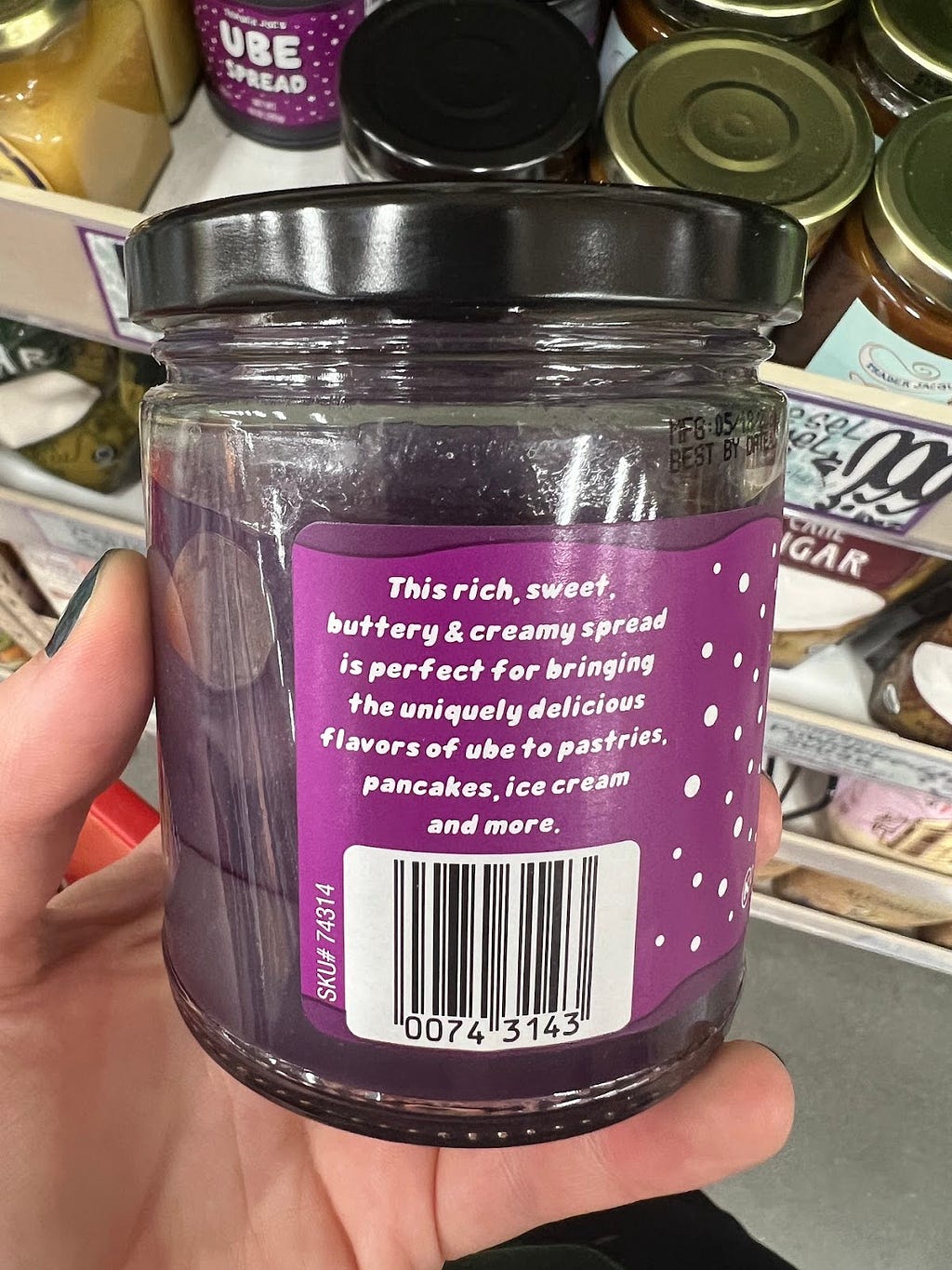 Product label that says “This rich, sweet, buttery & creamy spread is perfect for bringing the uniquely delicious flavors of ube to pastries, pancakes, ice cream and more.”