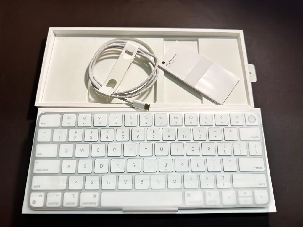 Unboxing reveals woven USB-C to lightning cable, paperwork and keyboard