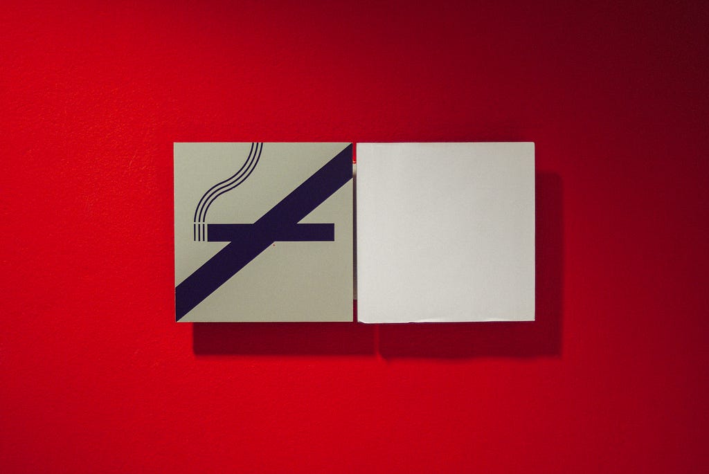 A no smoking sign in a red background