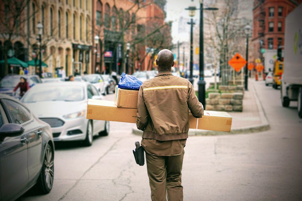 UPS driver delivering packages