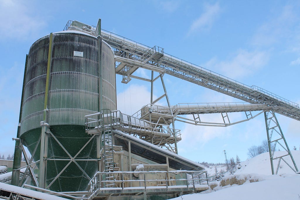 refinery surrounded by snow