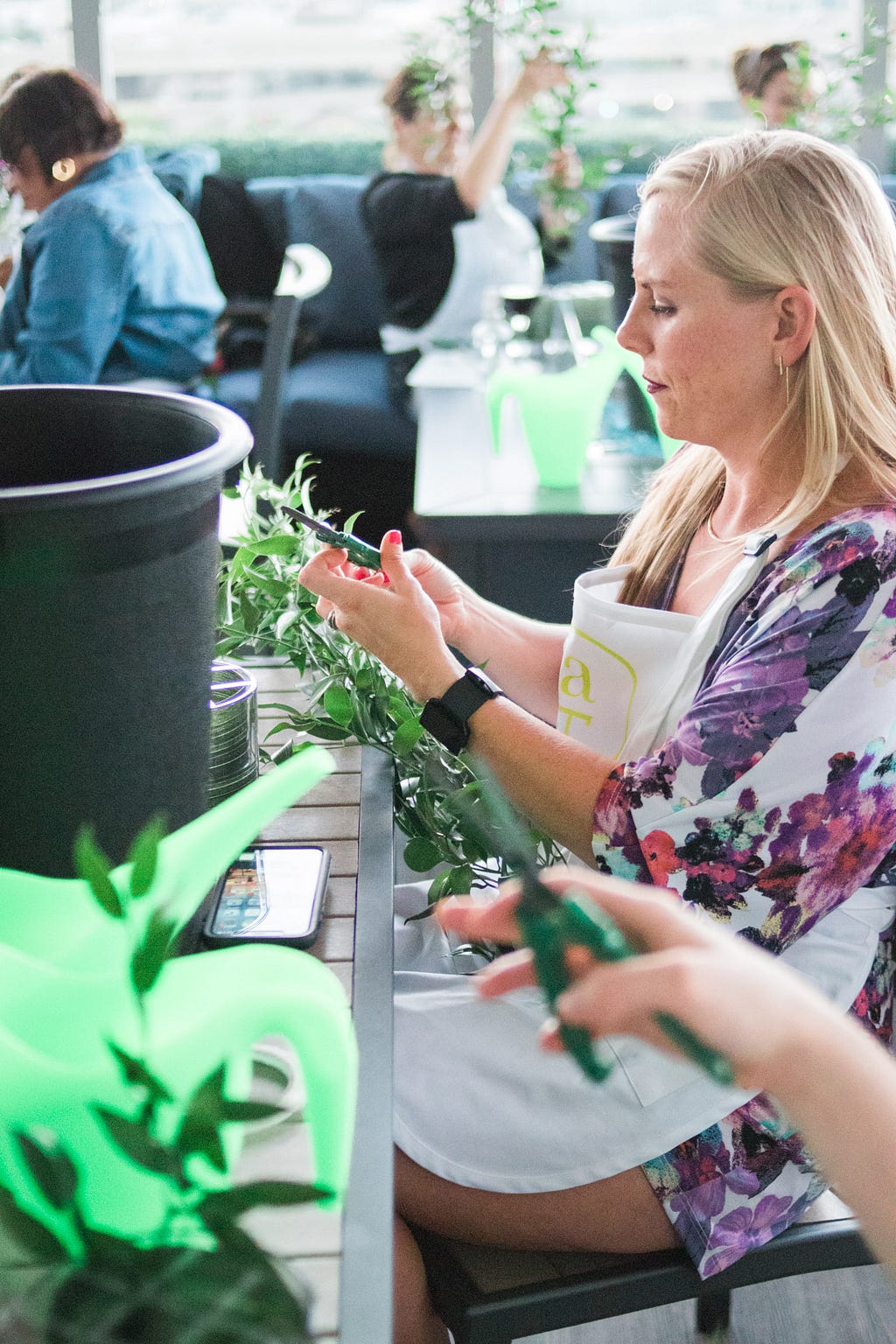 women making flower arrangements during Alice's Table workshop in Jacksonville, Florida