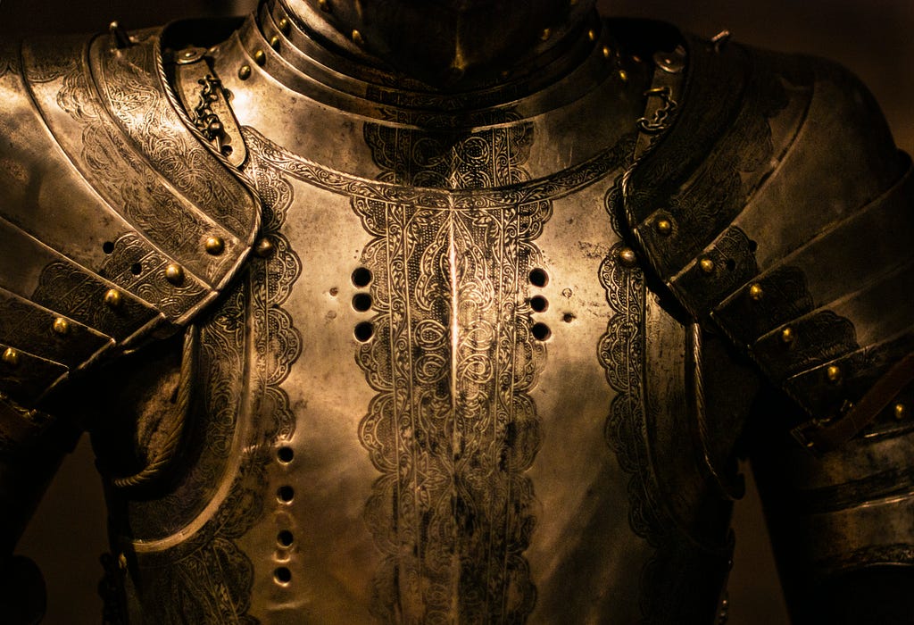 The chest of a golden suit of armour.