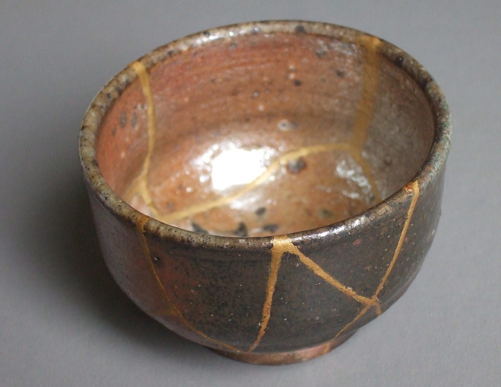 Example of kintsugi: golden dust lining where a cup was cracked. Much like our lifepath.