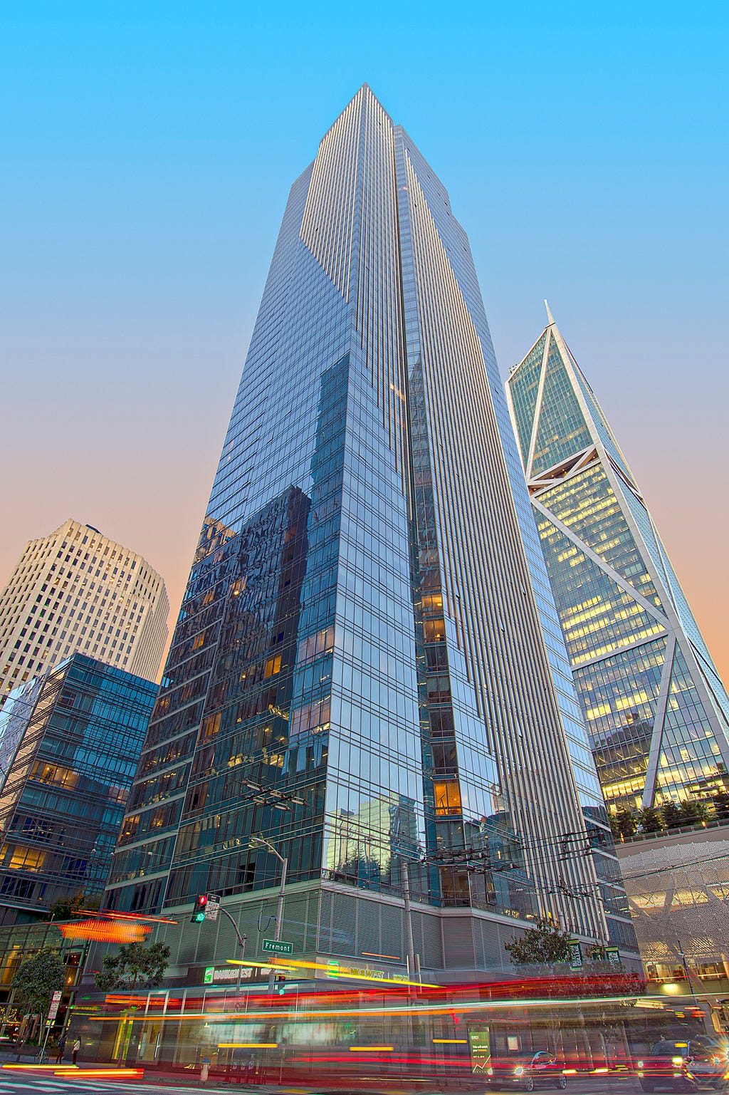 A large skyscraper and luxury apartment complex, surrounded by similar sized buildings