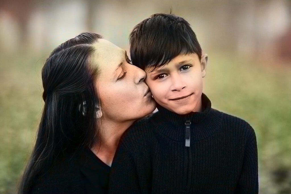 Colorized enhance image of mother kissing her son on the cheek in a forest with realistic skintones and blackground color